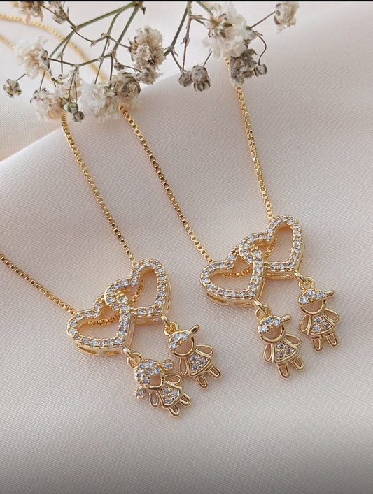 18-inch necklace featuring two sparkling heart pendants adorned with two child charms 12151