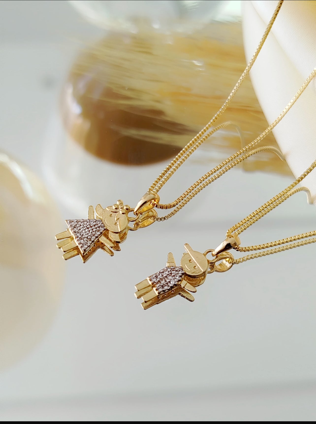 18-inch necklace with a thin child-shaped pendant with zirconia Stones 10753