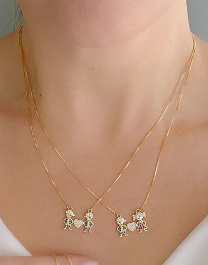 18-inch Necklace with Two Sparkling Child Charms and a Heart Pendant
