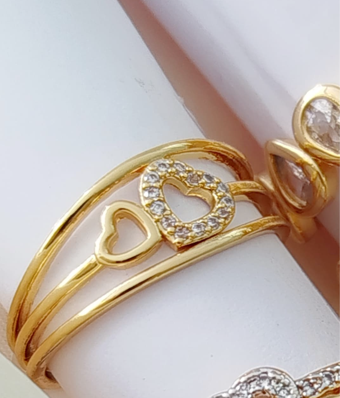 Stylish three-band ring featuring a sparkling heart and a plain one 10842