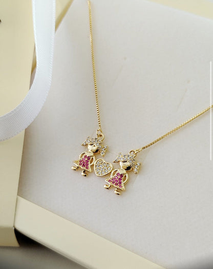 18-inch Necklace with Two Sparkling Child Charms and a Heart Pendant