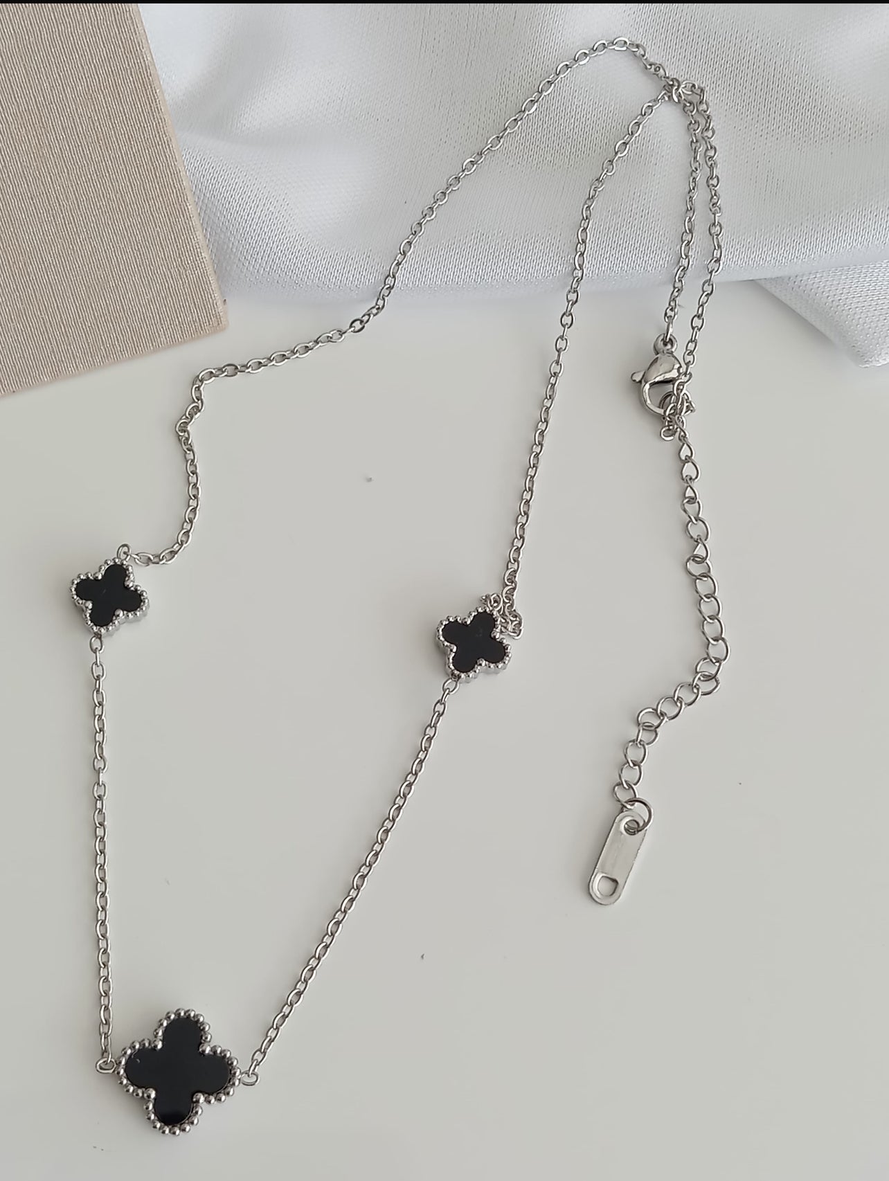 Stainless steel necklace with one large clover and two small side clovers 11338